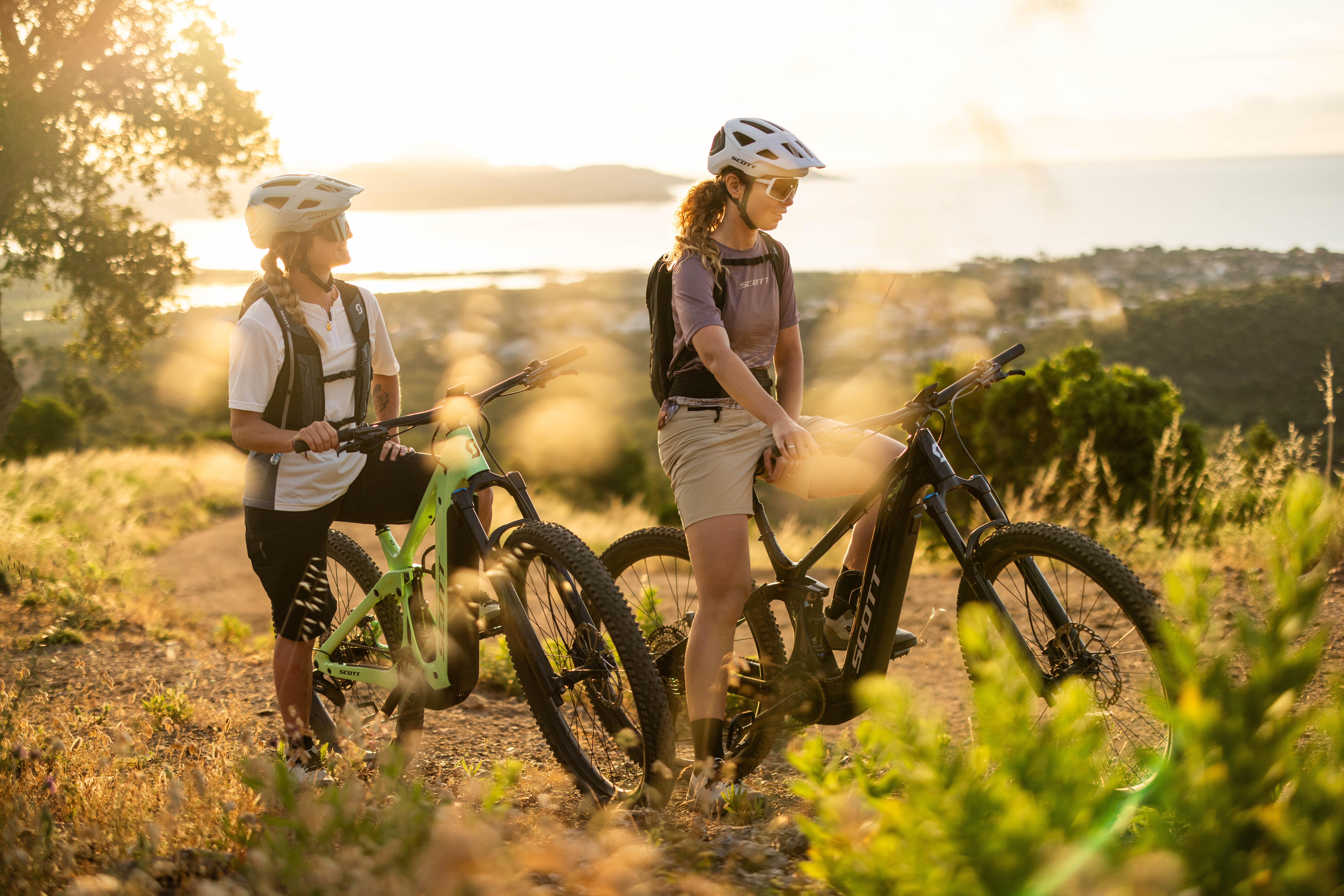 Scott e-bike riders at sunset