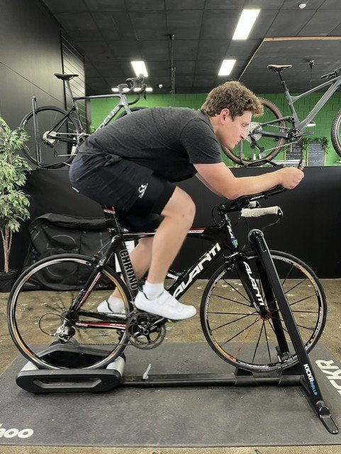 Triathlon bike position being checked on an indoor trainer